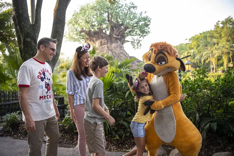 Timon with guests at Disney’s Animal Kingdom - Join our 2026 Walt Disney World Vacation Wait List